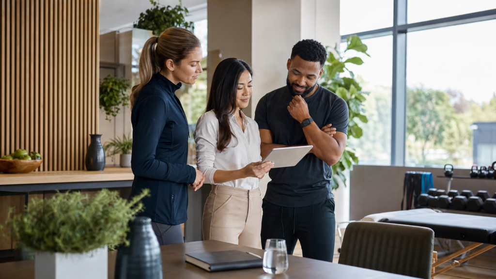 Wellness program manager, nutrition professional and fitness coach reviewing a plan in a modern wellness clinic