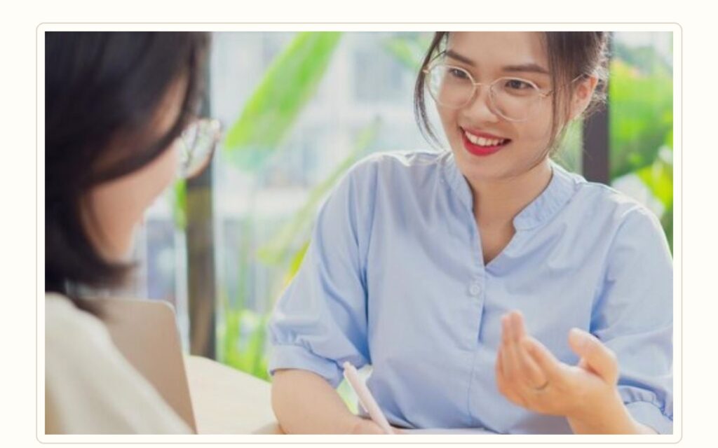 Spa employer interviewing a qualified massage therapist candidate in a calm professional setting