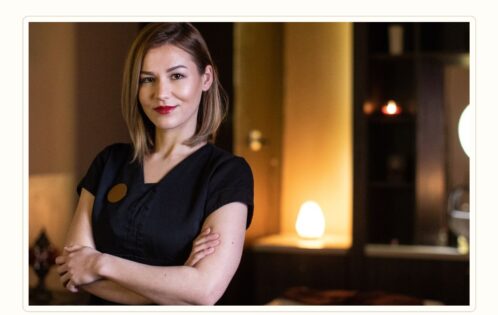 Spa manager reviewing massage therapist recruitment criteria in a premium wellness setting