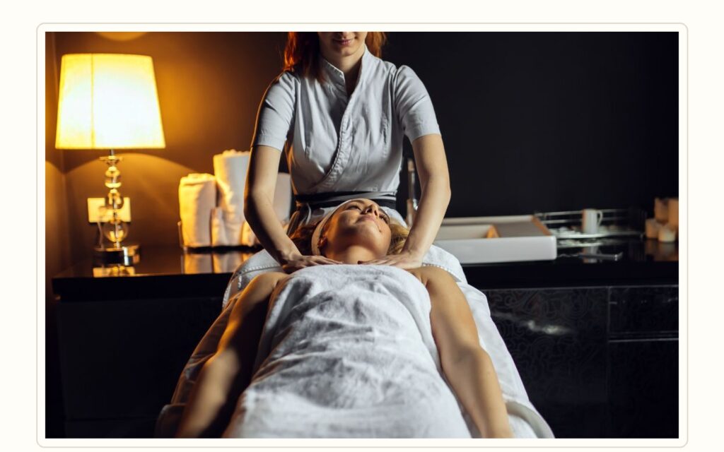 Spa therapist training session showing professional massage technique and retention support